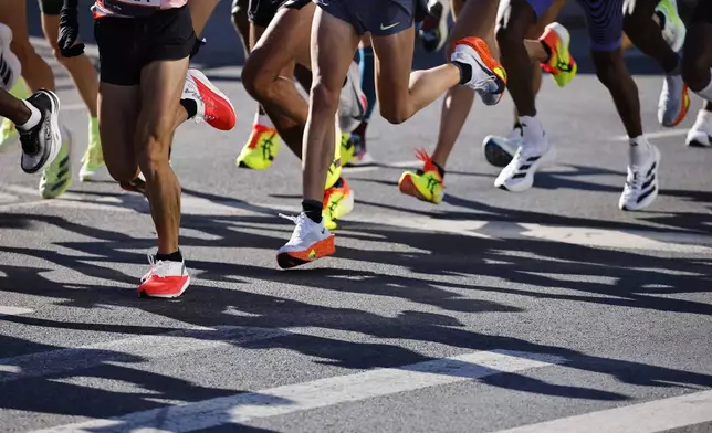 Runners in the men's elite division make their way through the Brooklyn borough during the New York City Marathon, Sunday, Nov. 3, 2024, in New York. (AP Photo/Eduardo Munoz Alvarez)