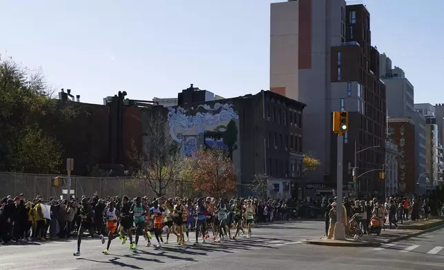 Runners in the men's elite division make their way through the Brooklyn borough during the New York City Marathon, Sunday, Nov. 3, 2024, in New York. (AP Photo/Eduardo Munoz Alvarez)