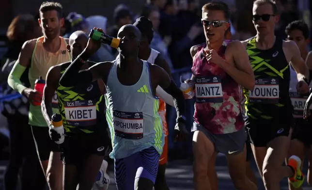 Runners in the men's elite division make their way through the Brooklyn borough during the New York City Marathon, Sunday, Nov. 3, 2024, in New York. (AP Photo/Eduardo Munoz Alvarez)