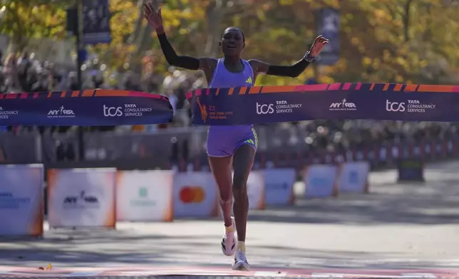 Kenya's Sheila Chepkirui crosses the finish line to win the women's division of the New York City Marathon, Sunday, Nov. 3, 2024, in New York. (AP Photo/Frank Franklin II)