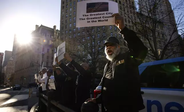 New York City Mayor Eric Adams supporters cheers as he exits from the US federal court house in New York, Friday, Nov. 01, 2024.(AP Photo/Kena Betancur)