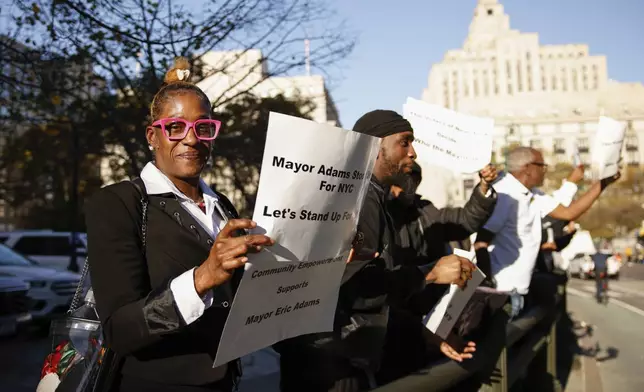 New York City Mayor Eric Adams supporters cheers as he exits from the US federal court house in New York, Friday, Nov. 01, 2024.(AP Photo/Kena Betancur)