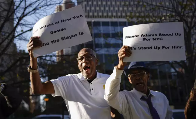 New York City Mayor Eric Adams supporters cheers as he exits from the US federal court house in New York, Friday, Nov. 01, 2024.(AP Photo/Kena Betancur)