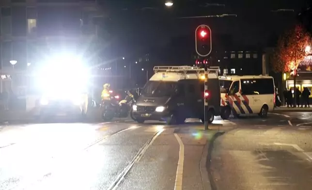 In this image taken from video, police vehicles and personnel patrol the streets of Amsterdam, Monday Nov. 11, 2024, as the city is facing tensions following violence last week. (AP Photo)