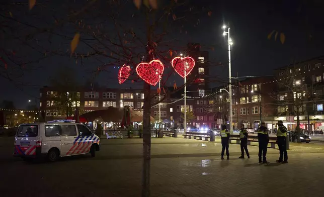 Police officers are patrolling a the Mercator square in Amsterdam, Netherlands, Tuesday, Nov. 12, 2024, as the city is facing tensions following violence last week. (AP Photo/Bram Janssen)