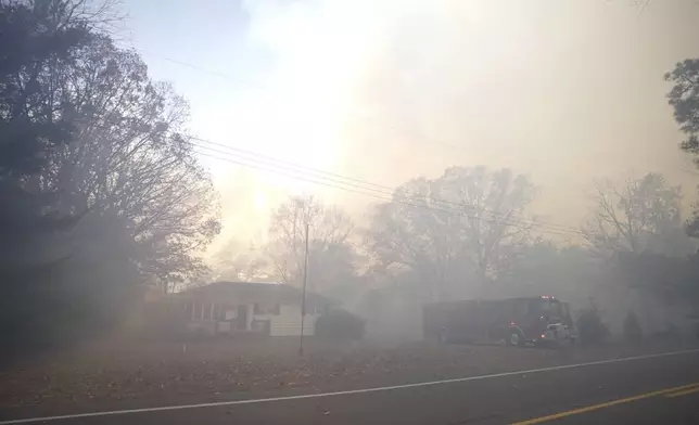 This photo provided by New Jersey Department of Environmental Protection smoke fills the air from a forest fire on Wednesday, Nov. 6, 2024 in Evesham, N.J. (New Jersey Department of Environmental Protection via AP)