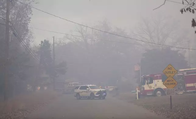 This photo provided by New Jersey Department of Environmental Protection smoke fills the air from a forest fire on Wednesday, Nov. 6, 2024 in Evesham, N.J. (New Jersey Department of Environmental Protection via AP)