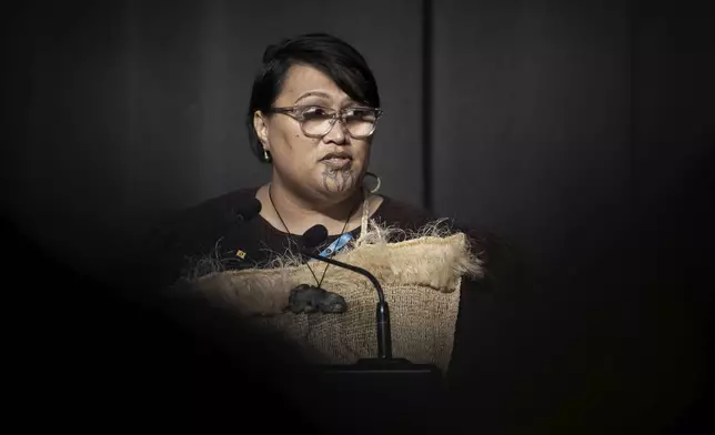 Abuse survivor, Tu Chapman, speaks following New Zealand's Prime Minister Christopher Luxon's "formal and unreserved" apology in Parliament for the widespread abuse, torture and neglect of hundreds of thousands of children and vulnerable adults in care, in Wellington, New Zealand Tuesday, Nov. 12, 2024. (Monique Ford/Stuff via AP)