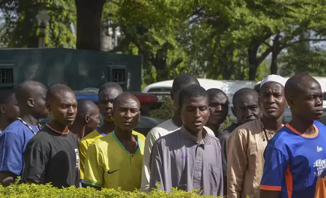 Children who had faced the death penalty for allegedly protesting against the country's cost of living crisis, are led to a courtroom in Abuja, Nigeria Tuesday, Nov. 5, 2024. (AP Photo/Olamikan Gbemiga)