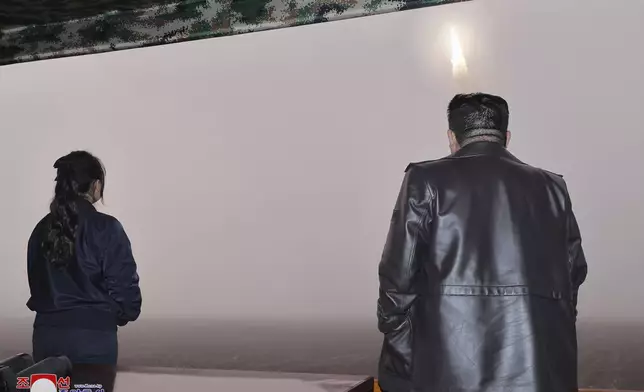 In this photo provided by the North Korean government, North Korean leader Kim Jong Un, right, and his daughter observe what it says a test launch of new intercontinental ballistic missile "Hwasong-19" at an undisclosed place in North Korea Thursday, Oct. 31, 2024. Independent journalists were not given access to cover the event depicted in this image distributed by the North Korean government. The content of this image is as provided and cannot be independently verified. Korean language watermark on image as provided by source reads: "KCNA" which is the abbreviation for Korean Central News Agency. (Korean Central News Agency/Korea News Service via AP)