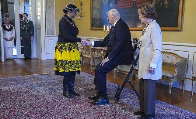 Norway's King Harald, centre, and Queen Sonja, right, welcome Rapa Nui Chilean politician Laura Tarita Rapu Alarcon, at the Royal Palace, in Oslo, Norway, Tuesday, Nov. 12, 2024. (Lise Åserud/NTB Scanpix via AP)