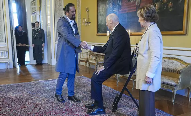 Norway's King Harald, centre, and Queen Sonja, right, welcome Miguel Pate Haoa, at the Royal Palace, in Oslo, Norway, Tuesday, Nov. 12, 2024. (Lise Aaserud/NTB Scanpix via AP)