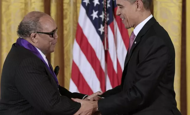 FILE - President Barack Obama presents a 2010 National Medal of Arts to musician and record producer Quincy Jones, Wednesday, March 2, 2011, during a ceremony in the East Room of the White House in Washington. Quincy Jones has died at age 91. (AP Photo/Pablo Martinez Monsivais, File)