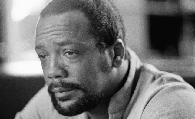 FILE - Quincy Jones, famed composer recovering from recent brain-blood-vessel surgery, relaxes at his Los Angeles music studio on Oct. 16, 1974. Quincy Jones died at age 91. (AP Photo/George Brich, File)