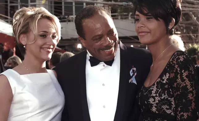 FILE - Quincy Jones, center, poses with his daughters Rashida, left and Kidada as they arrive at the 68th Annual Academy Awards in Los Angeles, Monday, March 25, 1996. Quincy Jones died at age 91. (AP Photo/Mark Terrill, File)