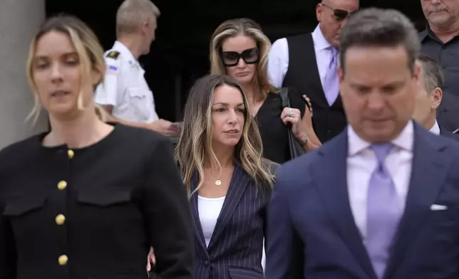 FILE- Defendant Karen Read, center, departs Norfolk Superior Court, Wednesday, June 26, 2024, in Dedham, Mass. (AP Photo/Steven Senne, File)