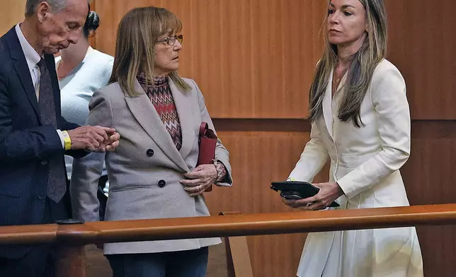 Karen Read, right, leaves the courtroom with parents William and Janet at the close of the case in Boston, Wednesday, Nov. 6, 2024. (Greg Derr/The Patriot Ledger via AP, Pool)