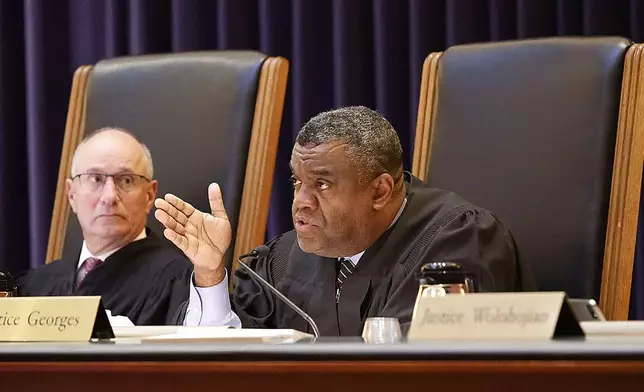 Justice Serge Georges Jr. asks Read attorney Martin Weinberg a question, as Justice Scott Kafker, at left, listens during the Karen Read trial at the Massachusetts Supreme Court in Boston, Wednesday, Nov. 6, 2024. (Greg Derr/The Patriot Ledger via AP, Pool)