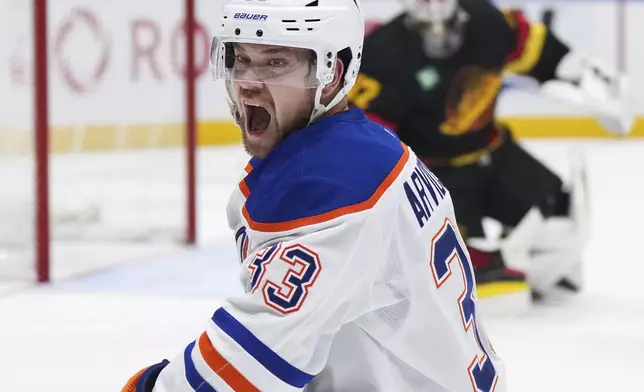 Edmonton Oilers' Viktor Arvidsson (33) celebrates his goal against the Vancouver Canucks during the second of an NHL hockey game in Vancouver, on Saturday, Nov. 9, 2024. (Darryl Dyck/The Canadian Press via AP)