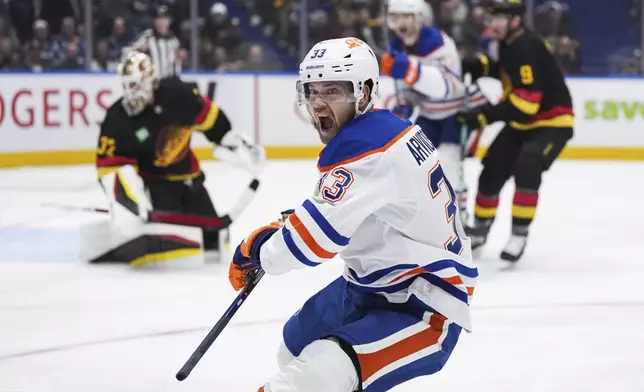 Edmonton Oilers' Viktor Arvidsson (33) celebrates his goal against the Vancouver Canucks during the second of an NHL hockey game in Vancouver, on Saturday, Nov. 9, 2024. (Darryl Dyck/The Canadian Press via AP)