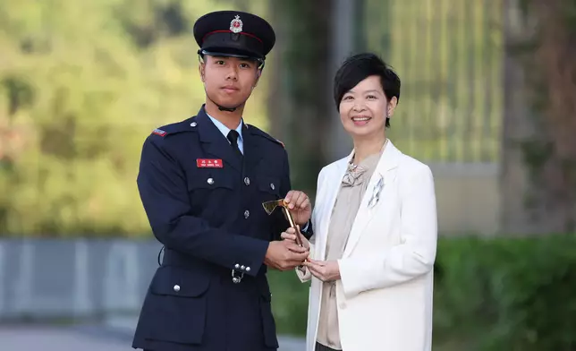 S for Housing reviews Fire Services passing-out parade  Source: HKSAR Government Press Releases