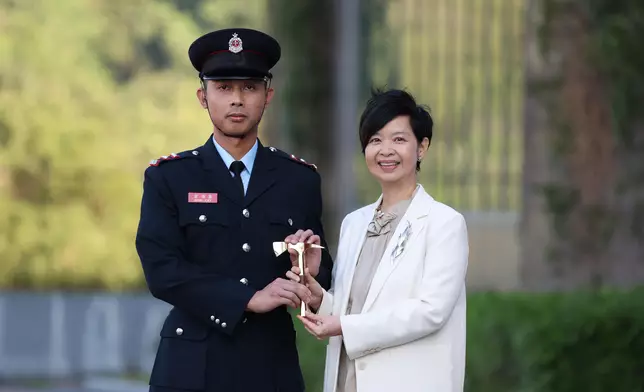 S for Housing reviews Fire Services passing-out parade  Source: HKSAR Government Press Releases