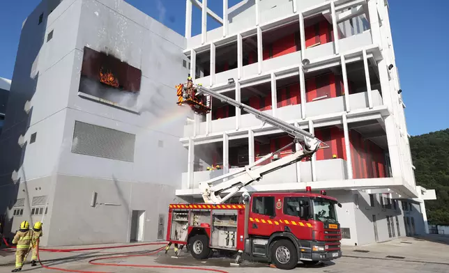 S for Housing reviews Fire Services passing-out parade  Source: HKSAR Government Press Releases