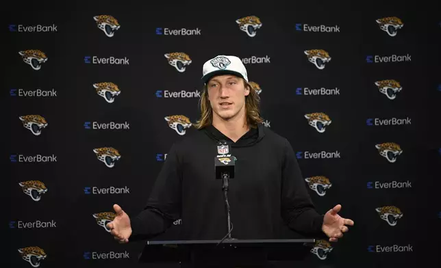 Jacksonville Jaguars' Trevor Lawrence talks during a news conference after an NFL football game against the Green Bay Packers Sunday, Oct. 27, 2024, in Jacksonville, Fla. (AP Photo/Phelan M. Ebenhack)