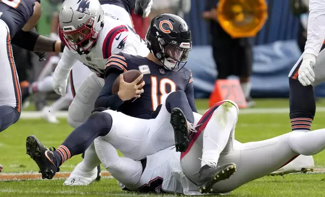 New England Patriots linebacker Anfernee Jennings sacks Chicago Bears quarterback Caleb Williams during the first half of an NFL football game Sunday, Nov. 10, 2024, in Chicago. (AP Photo/Nam Y. Huh)