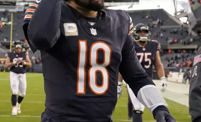 Chicago Bears quarterback Caleb Williams walks off the field after the Bears' 19-3 loss to the New England Patriots in an NFL football game Sunday, Nov. 10, 2024, in Chicago. (AP Photo/Nam Y. Huh)