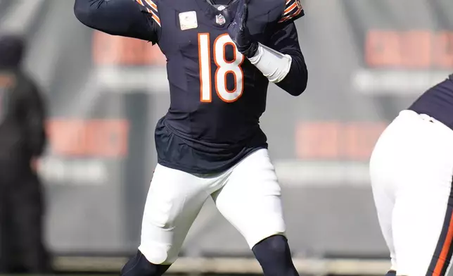 Chicago Bears quarterback Caleb Williams passes during the first half of an NFL football game against the New England Patriots on Sunday, Nov. 10, 2024, in Chicago. (AP Photo/Erin Hooley)