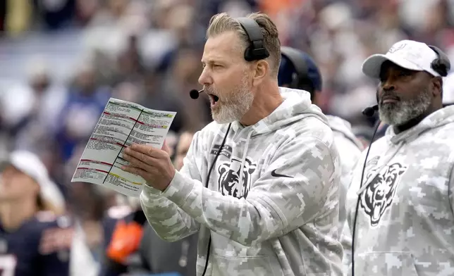 Chicago Bears head coach Matt Eberflus applaudes his team during the first half of an NFL football game against the New England Patriots on Sunday, Nov. 10, 2024, in Chicago. (AP Photo/Nam Y. Huh)