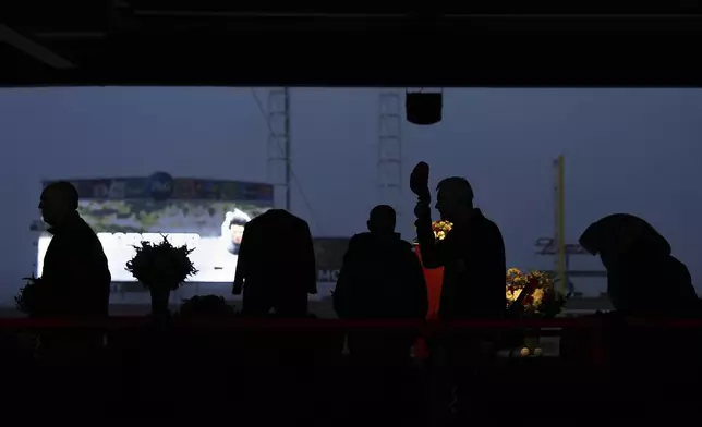 Baseball fans line up to pay their respects to Cincinnati Reds legend Pete Rose during a public visitation, Sunday, Nov. 10, 2024, at Great American Ball Park in Cincinnati. (AP Photo/Kareem Elgazzar)