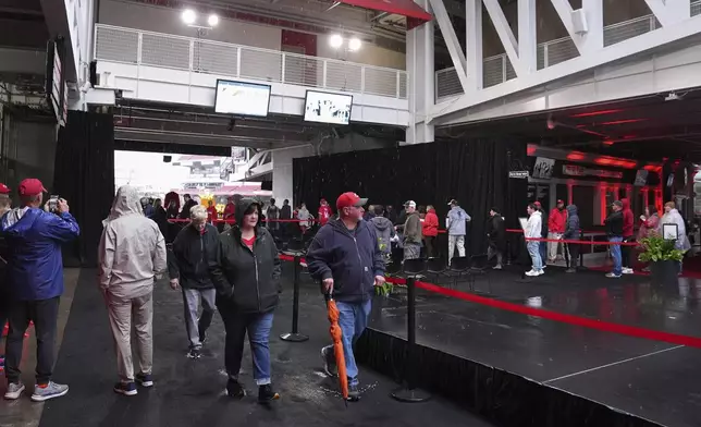 Baseball fans line up to pay their respects to Cincinnati Reds legend Pete Rose during a public visitation, Sunday, Nov. 10, 2024, at Great American Ball Park in Cincinnati. (AP Photo/Kareem Elgazzar)