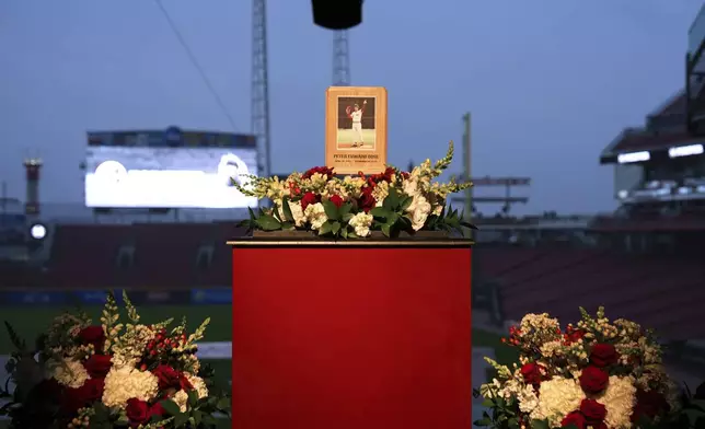 Baseball fans line up to pay their respects to Cincinnati Reds legend Pete Rose during a public visitation, Sunday, Nov. 10, 2024, at Great American Ball Park in Cincinnati. (AP Photo/Kareem Elgazzar)