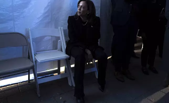 Democratic presidential nominee Vice President Kamala Harris looks at a monitor of the event from backstage, just before taking the stage for her final campaign rally, Monday, Nov. 4, 2024, in Philadelphia. (AP Photo/Jacquelyn Martin)