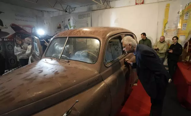 This Warszawa M-20 car with serial number 000001, based on a Soviet Union's model, was the first vehicle to leave a car factory in Poland after World War II, on Nov. 6, 1951 and now, 73 years later, it goes on public display at a private museum in Otrebusy, central Poland, on Wednesday, Nov. 6, 2024. (AP Photo/Czarek Sokolowski)