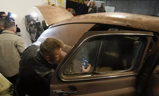 This Warszawa M-20 car with serial number 000001, based on a Soviet Union's model, was the first vehicle to leave a car factory in Poland after World War II, on Nov. 6, 1951 and now, 73 years later, it goes on public display at a private museum in Otrebusy, central Poland, on Wednesday, Nov. 6, 2024. (AP Photo/Czarek Sokolowski)