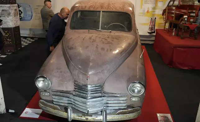 This Warszawa M-20 car with serial number 000001, based on a Soviet Union's model, was the first vehicle to leave a car factory in Poland after World War II, on Nov. 6, 1951 and now, 73 years later, it goes on public display at a private museum in Otrebusy, central Poland, on Wednesday, Nov. 6, 2024. (AP Photo/Czarek Sokolowski)