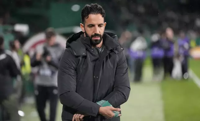 Sporting's head coach Ruben Amorim puts on his coach armband before a Portuguese league soccer match between Sporting CP and Estrela da Amadora at the Alvalade stadium in Lisbon, Friday, Nov. 1, 2024. (AP Photo/Armando Franca)