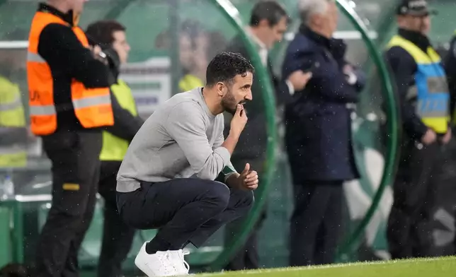 Sporting's head coach Ruben Amorim watches from the touchline during a Portuguese league soccer match between Sporting CP and Estrela da Amadora at the Alvalade stadium in Lisbon, Friday, Nov. 1, 2024. (AP Photo/Armando Franca)