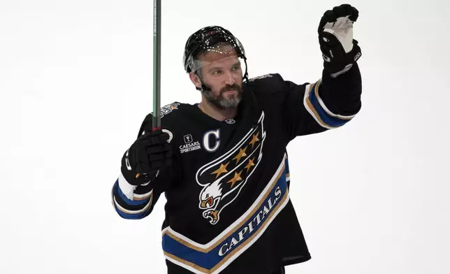 Washington Capitals left wing Alex Ovechkin (8) waves to the crowd after an NHL hockey game against the Nashville Predators, Wednesday, Nov. 6, 2024, in Washington. The Capitals won 3-2. (AP Photo/Nick Wass)