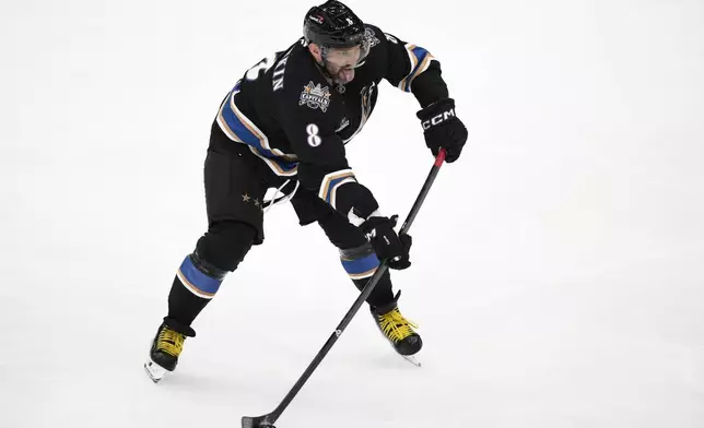 Washington Capitals left wing Alex Ovechkin (8) skates with the puck during the third period of an NHL hockey game against the Nashville Predators, Wednesday, Nov. 6, 2024, in Washington. The Capitals won 3-2. (AP Photo/Nick Wass)