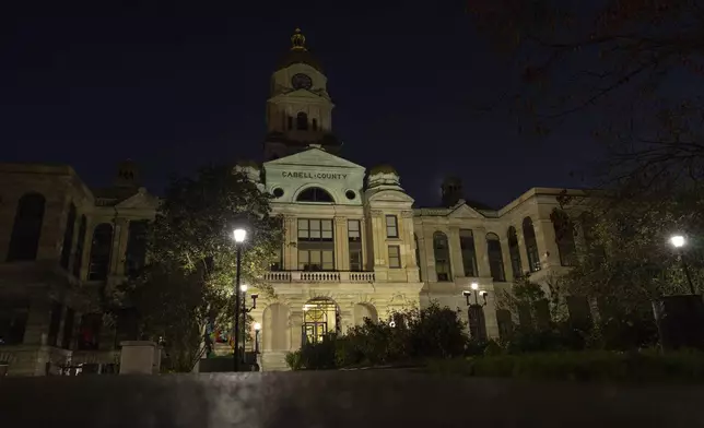 The courtyard outside the Cabell County Courthouse sits empty after hours, Wednesday, Oct. 9, 2024, in Huntington, W. Va. (AP Photo/Carolyn Kaster)