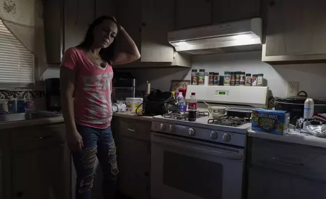 April Youst stands in her kitchen in West Virginia on Wednesday, Oct. 9, 2024. (AP Photo/Carolyn Kaster)