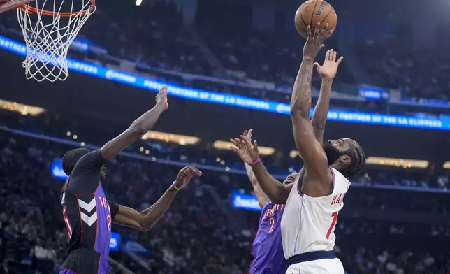 Los Angeles Clippers guard James Harden (1) drives to the basket during the first half of an NBA basketball game against the Toronto Raptors, Saturday, Nov. 9, 2024, in Inglewood, Calif. (AP Photo/Marcio Jose Sanchez)