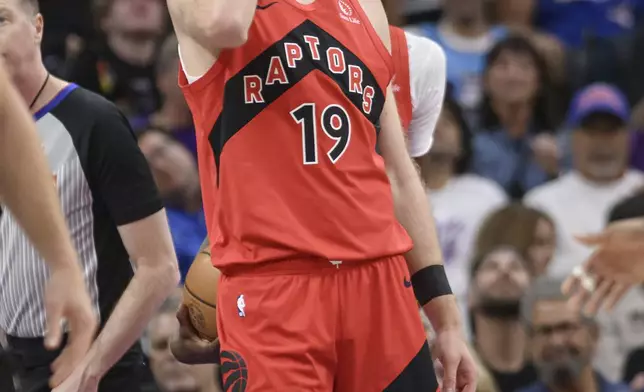 Toronto Raptors center Jakob Poeltl (19) reacts to an official's call during the first half of an NBA basketball game against the Sacramento Kings in Sacramento, Calif., Wednesday, Nov. 6, 2024. (AP Photo/Randall Benton)