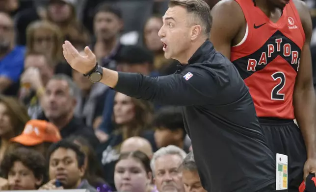 Toronto Raptors head coach Darko Rajakovic shouts instructions from the bench during the first half of an NBA basketball game against the Sacramento Kings in Sacramento, Calif., Wednesday, Nov. 6, 2024. (AP Photo/Randall Benton)