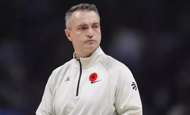 Toronto Raptors head coach Darko Rajakovic looks on in the first half of an NBA basketball game against the Denver Nuggets, Monday, Nov. 4, 2024, in Denver. (AP Photo/David Zalubowski)