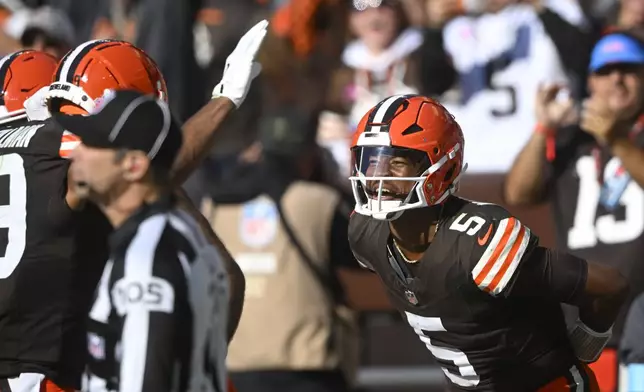 Cleveland Browns quarterback Jameis Winston (5) celebrates a touchdown pass to wide receiver Cedric Tillman (19) against the Baltimore Ravens during the second half of an NFL football game in Cleveland, Sunday, Oct. 27, 2024. (AP Photo/David Richard)